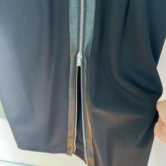 New Cache black stylish below the knee dress. Leather accents,zipper down back. - Picture 6 of 7